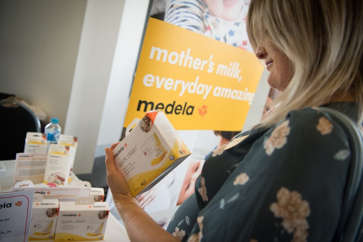 A mum creator holding a product during a campaign shoot
