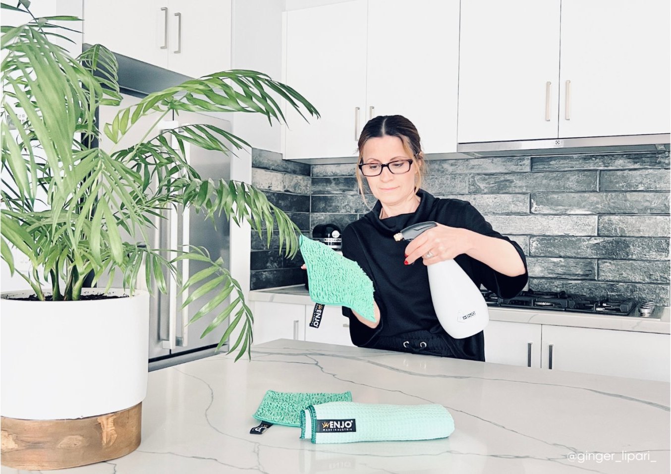 A mum creator demonstrating cleaning products in her kitchen